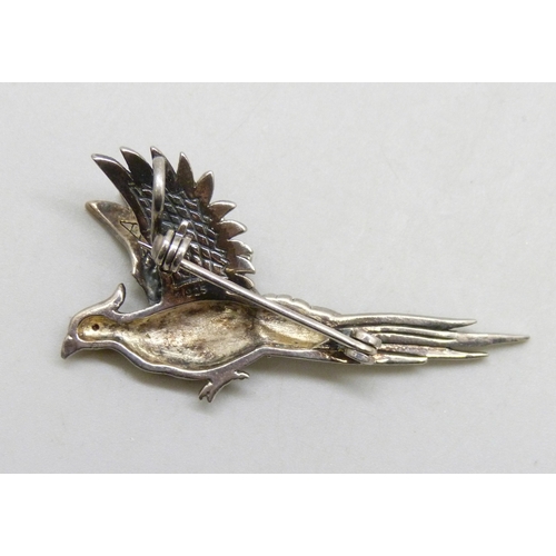 7034 - A silver brooch in the form of a pheasant set with enamel and marcasite, 4.7cm