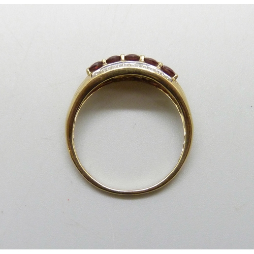 7036 - A 9ct gold, garnet and diamond ring, 2.4g, S