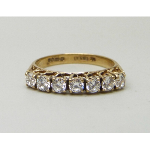 7042 - A 9ct gold ring set with seven cubic zirconia stones, 2.4g, P