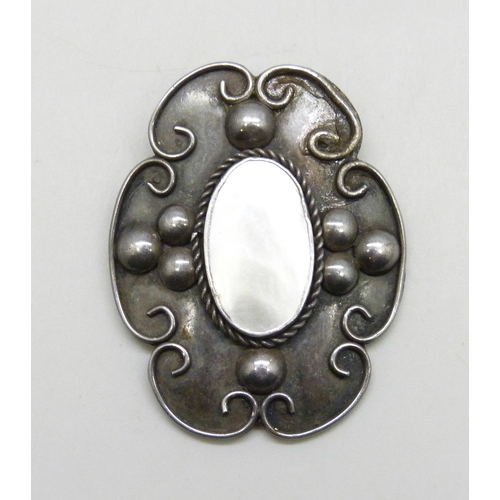 7045 - A large late 19th/early 20th century Arts & Crafts white metal and mother of pearl brooch with bail ... 