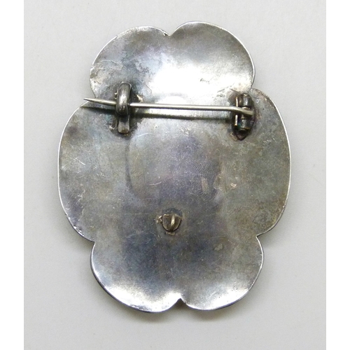 7045 - A large late 19th/early 20th century Arts & Crafts white metal and mother of pearl brooch with bail ... 
