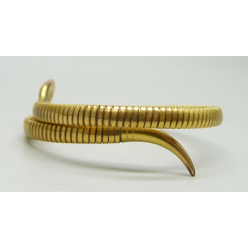 7049 - A rolled gold snake bangle with enamel head, 12.8g, 5.5 x 5cm