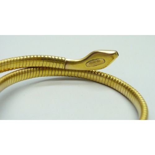 7049 - A rolled gold snake bangle with enamel head, 12.8g, 5.5 x 5cm