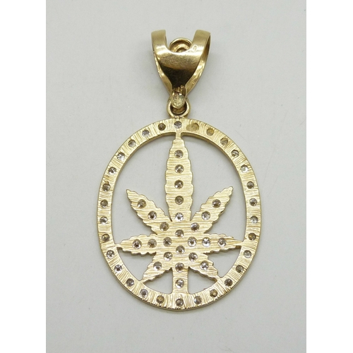 7052 - A large 9ct gold pendant set with white stones, 16.1g, 6.7cm including bail