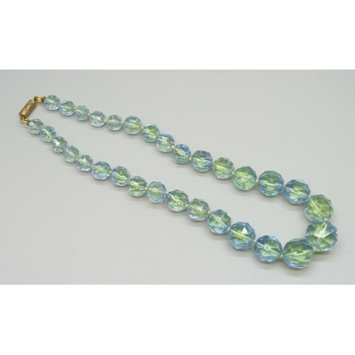 7056 - A circa 1930s Art Deco uranium faceted glass bead necklace, some wear to beads, 39.5cm, 55g