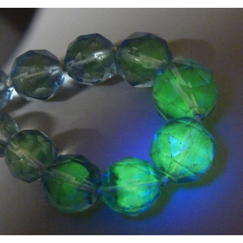 7056 - A circa 1930s Art Deco uranium faceted glass bead necklace, some wear to beads, 39.5cm, 55g