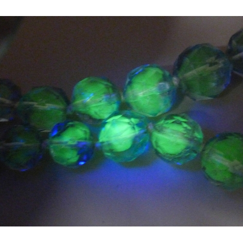 7056 - A circa 1930s Art Deco uranium faceted glass bead necklace, some wear to beads, 39.5cm, 55g