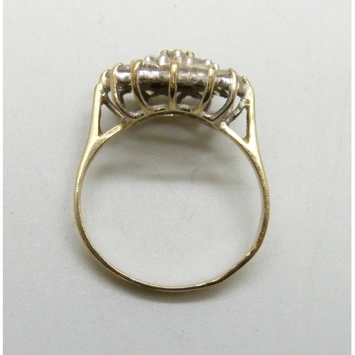7059 - A 9ct gold cubic zirconia cluster ring, band slightly misshapen, 2.4g, K/L