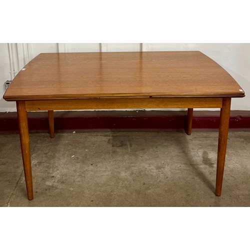 60 - A teak extending dining table