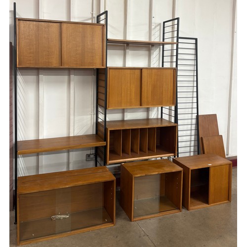 67 - A Staples teak and black tubular metal three bay Ladderax room divider, designed by Robert Heal