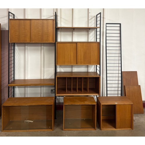 67 - A Staples teak and black tubular metal three bay Ladderax room divider, designed by Robert Heal