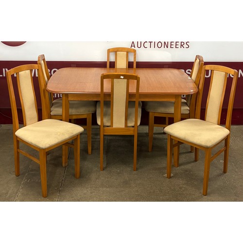 108 - A teak rectangular extending dining table and six chairs