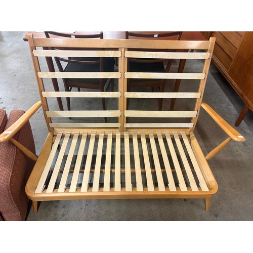 59 - An Ercol Blonde beech model 403 settee
