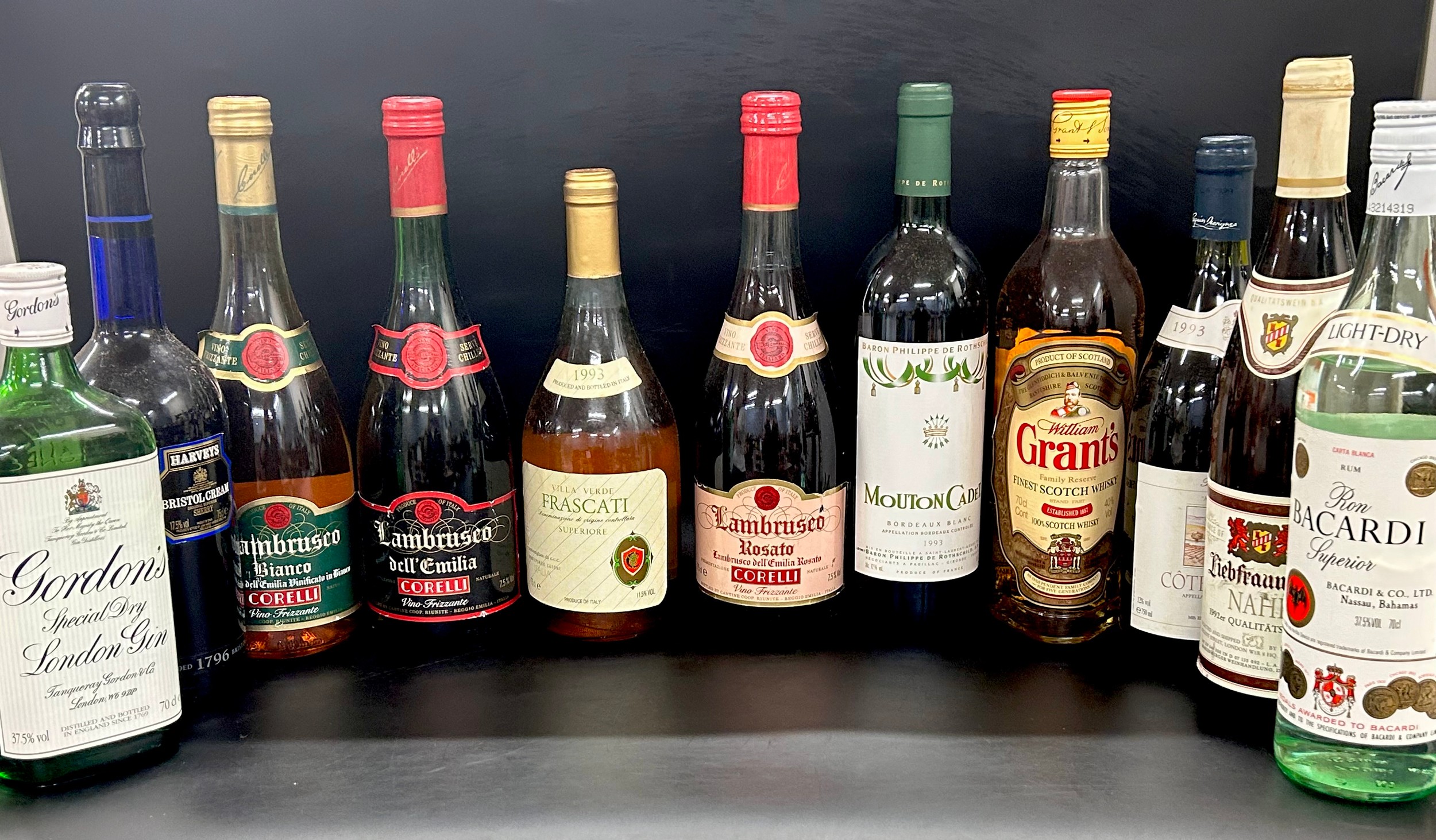 A box of vintage alcohol bottles including Grant's whisky employee ...