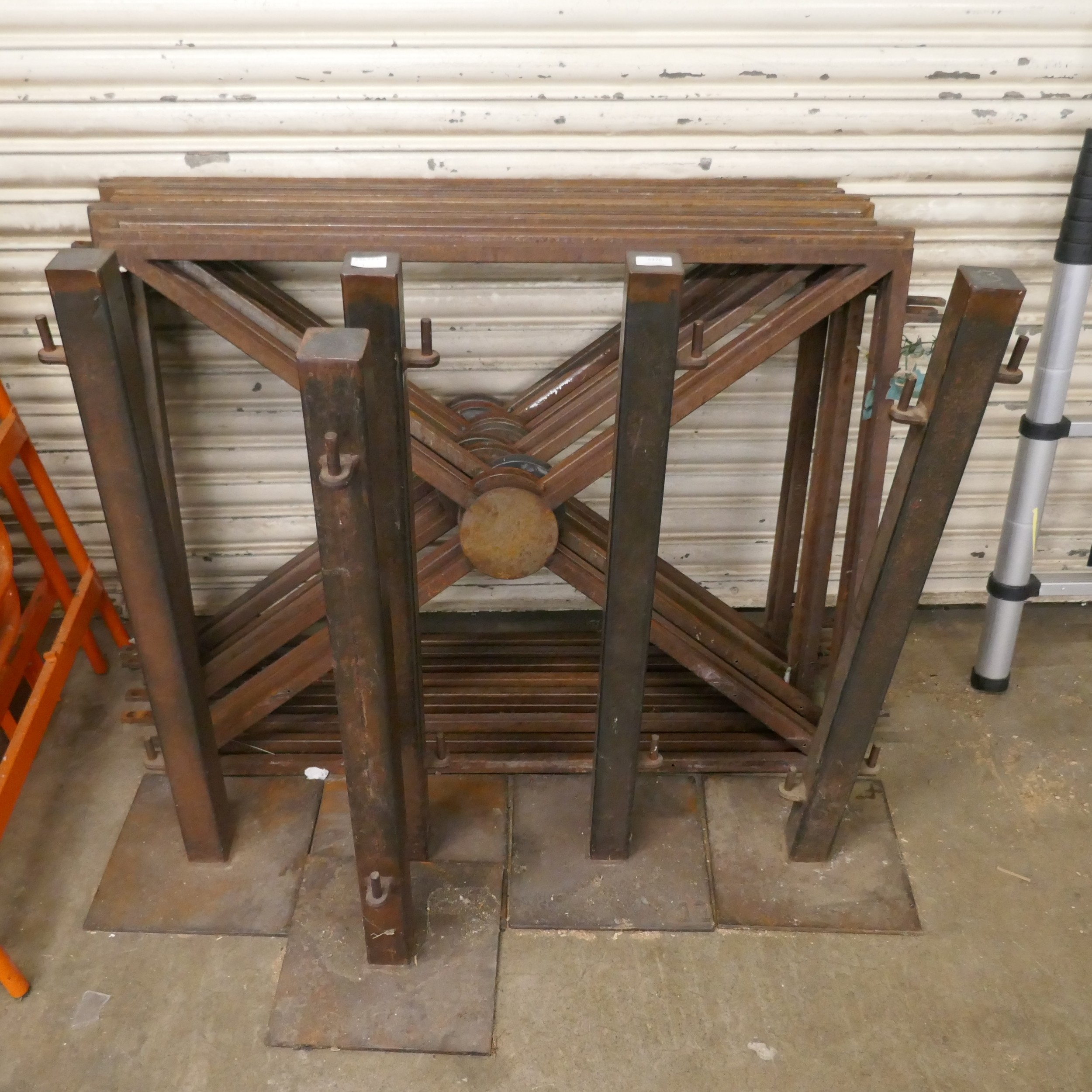 A quantity of iron fabricated bases and posts