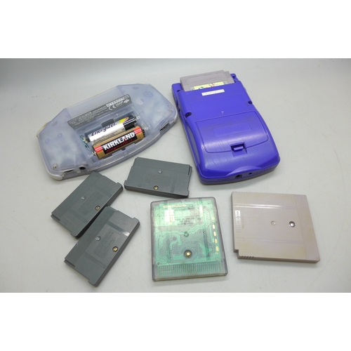 A Nintendo Gameboy Advance and Purple Gameboy colour console, games ...
