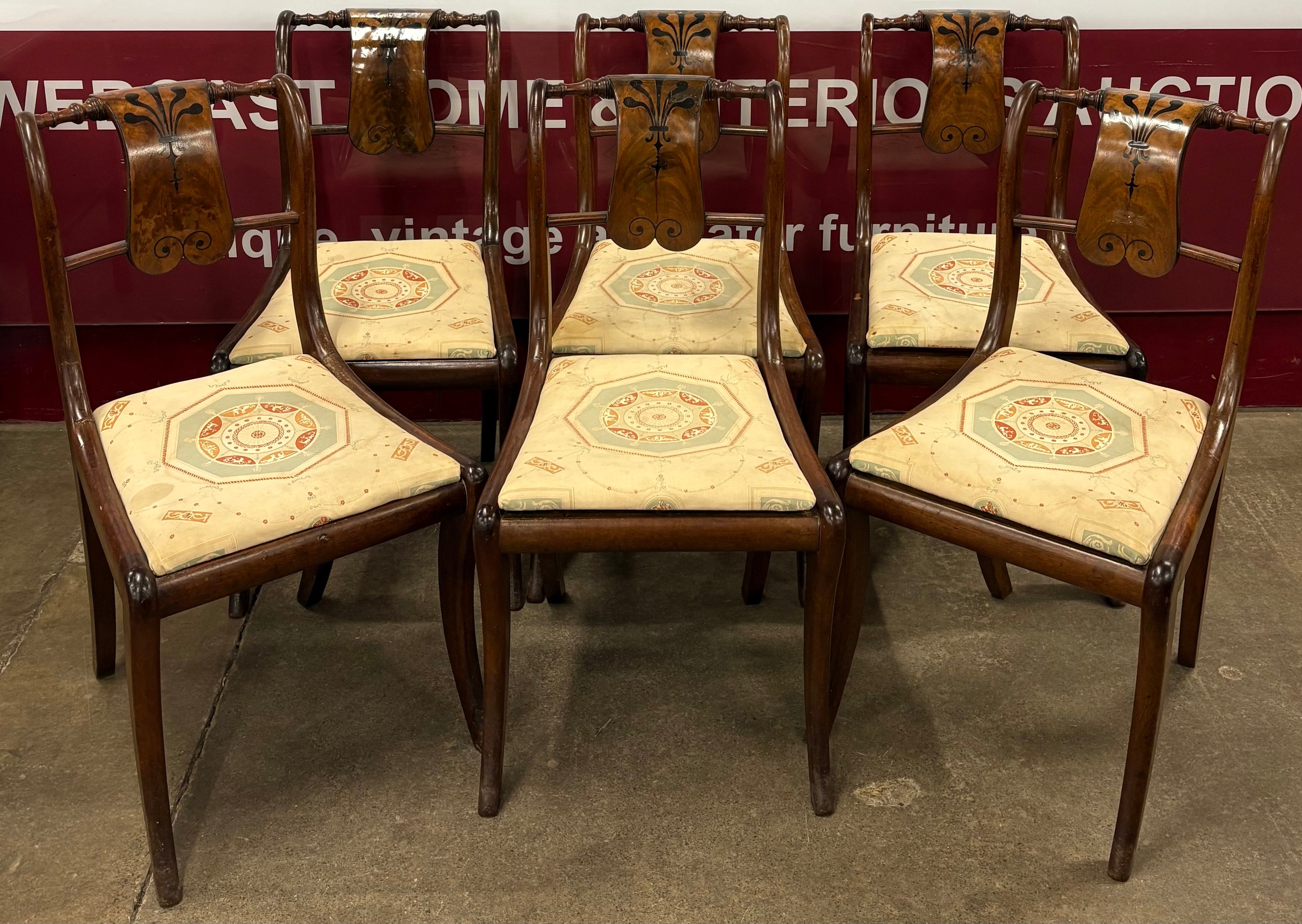 A set of six Regency inlaid mahogany dining chairs