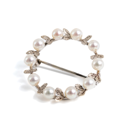 2 - A white metal and pearl circular wreath brooch, set with ten 4mm cultured pearls with textured leaf ... 