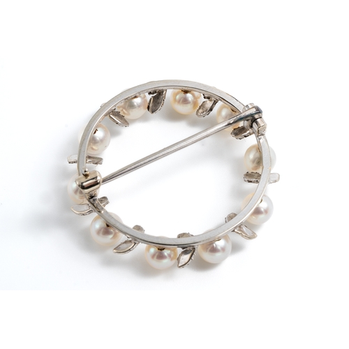 2 - A white metal and pearl circular wreath brooch, set with ten 4mm cultured pearls with textured leaf ... 