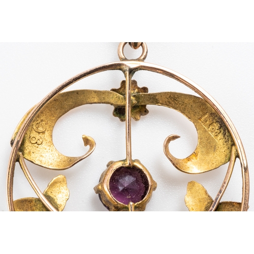 3 - An Edwardian 9ct yellow gold and amethyst pendant and chain, set with three round cut amethyst withi... 