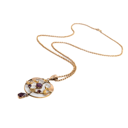 3 - An Edwardian 9ct yellow gold and amethyst pendant and chain, set with three round cut amethyst withi... 