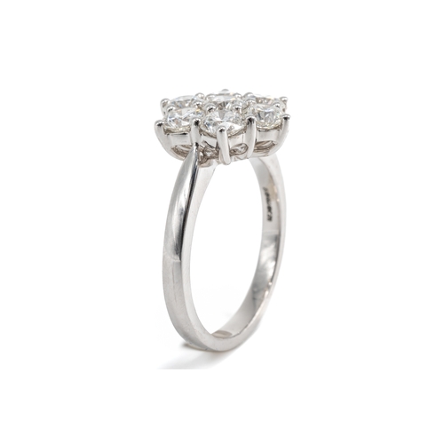 7 - An 18ct white gold and diamond seven-stone floral cluster ring, set with round brilliant-cut diamond... 