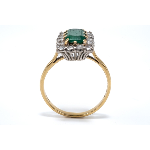 9 - A yellow gold emerald and diamond rectangular cluster ring, the central step-cut emerald approx 10mm... 