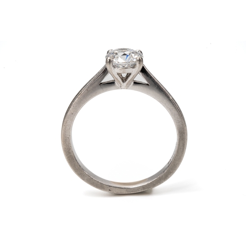 14 - A platinum and diamond solitaire ring, the round brilliant-cut diamond approx 0.60ct, clarity assess... 