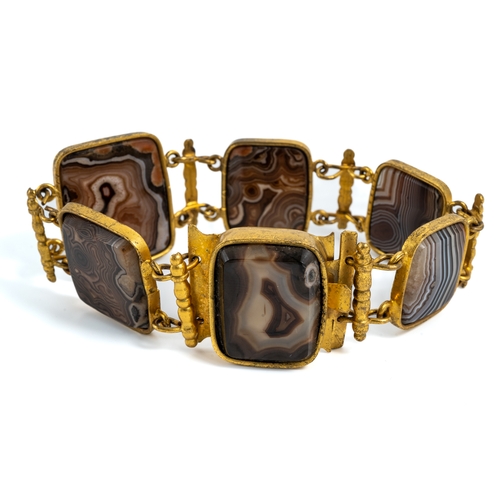 16 - A 19th century gilt metal and agate bracelet, set with six rectangular polished agate panels, approx... 