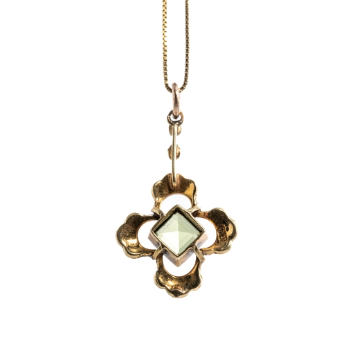 21 - An Edwardian 15ct yellow gold peridot and seed pearl pendant, set with a square-cut peridot surround... 