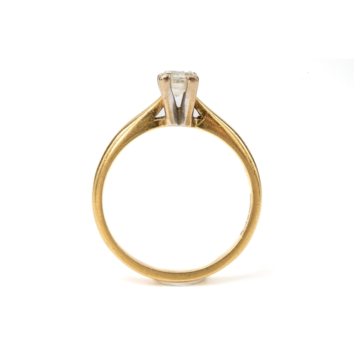 28 - An 18ct yellow gold and diamond solitaire ring, set with a millennium-cut diamond, ring size O, gros... 