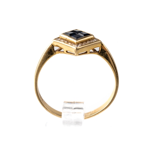 33 - A 14k yellow gold sapphire and diamond ring, set with four square-cut sapphires surrounded by cubic ... 