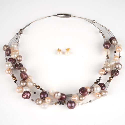 42 - An Odessea freshwater pearl necklace, the button and potato pearls with purple, cream and silver ove... 