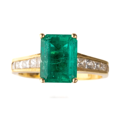 46 - An 18k yellow gold emerald and diamond ring, the step-cut emerald approx 9.5mm x 7mm, in four prong ... 