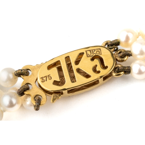 47 - A three-row graduated cultured pearl necklace, with a 9ct yellow gold clasp, approx 42cm long