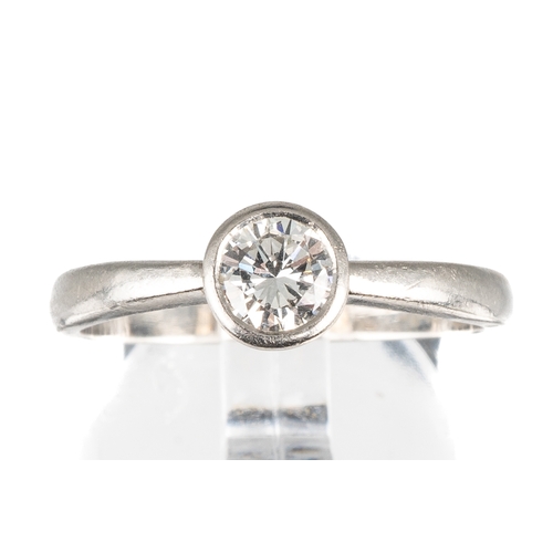 51 - A platinum and diamond solitaire ring, set with a round brilliant-cut diamond approx 0.35ct in a rub... 