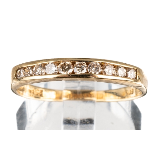 52 - A 9ct yellow gold and diamond ten-stone half eternity ring, channel set round brilliant-cut diamonds... 