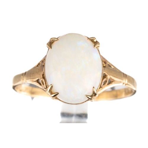 53 - A 9ct yellow gold and opal ring, set with an oval cabochon opal approx 10mm x 8mm, ring size P, tota... 