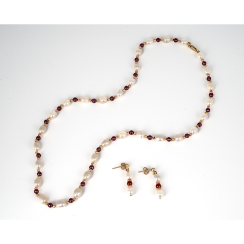 58 - Jersey Pearl - A 9ct gold pearl and garnet necklace and earring set, the 46cm long necklace with fre... 