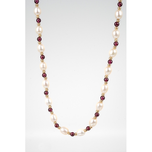 58 - Jersey Pearl - A 9ct gold pearl and garnet necklace and earring set, the 46cm long necklace with fre... 