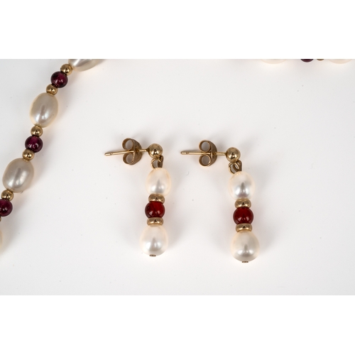 58 - Jersey Pearl - A 9ct gold pearl and garnet necklace and earring set, the 46cm long necklace with fre... 