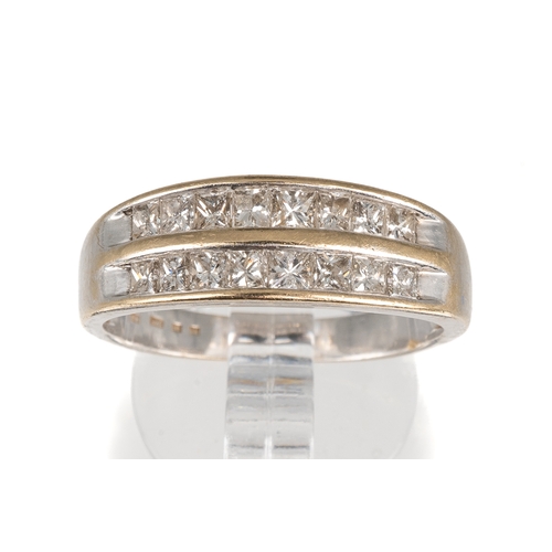 65 - A white gold and diamond two-row ring, channel set with sixteen princess-cut diamonds, ring size O1/... 