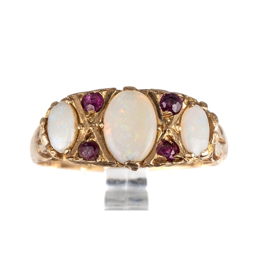 67 - A 9ct yellow gold opal and ruby ring, the three graduated oval cabochon opals with ruby highlights, ... 