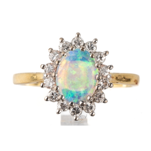 71 - An 18ct yellow gold opal and diamond oval cluster ring, size Q1/2, total gross weight approx 3.8g