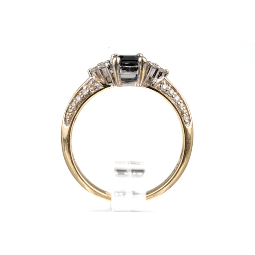 74 - A 10k yellow gold sapphire and diamond ring, set with an emerald-cut sapphire flanked by six diamond... 