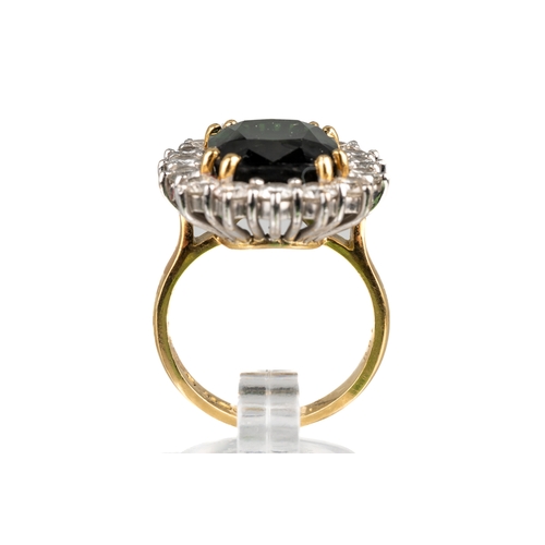 76 - An 18ct yellow gold green tourmaline and diamond square cluster ring, the cushion cut tourmaline app... 