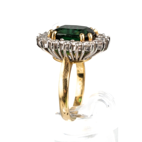 76 - An 18ct yellow gold green tourmaline and diamond square cluster ring, the cushion cut tourmaline app... 