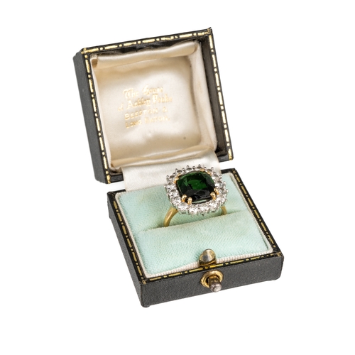 76 - An 18ct yellow gold green tourmaline and diamond square cluster ring, the cushion cut tourmaline app... 