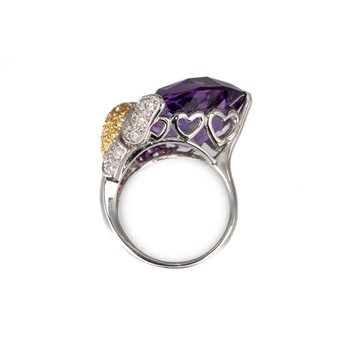 77 - An 18ct white gold diamond and amethyst dress ring, set with a large faceted heart shaped amethyst, ... 