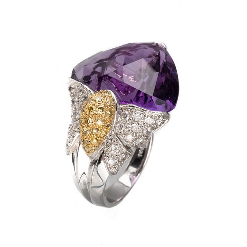 77 - An 18ct white gold diamond and amethyst dress ring, set with a large faceted heart shaped amethyst, ... 